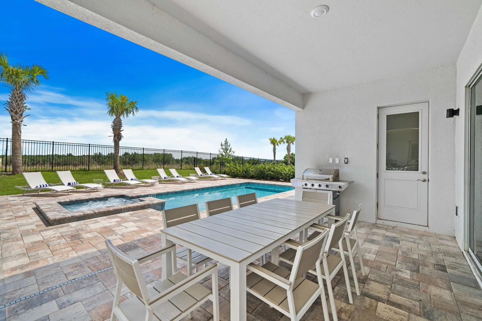 Resort-style pool and patio of a private Eden Gardens villa